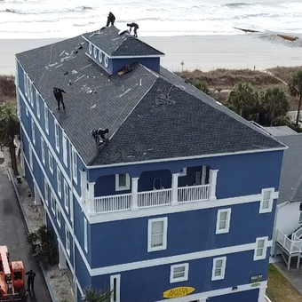 Roof replacement in progress on an oceanfront property along the Carolina coast