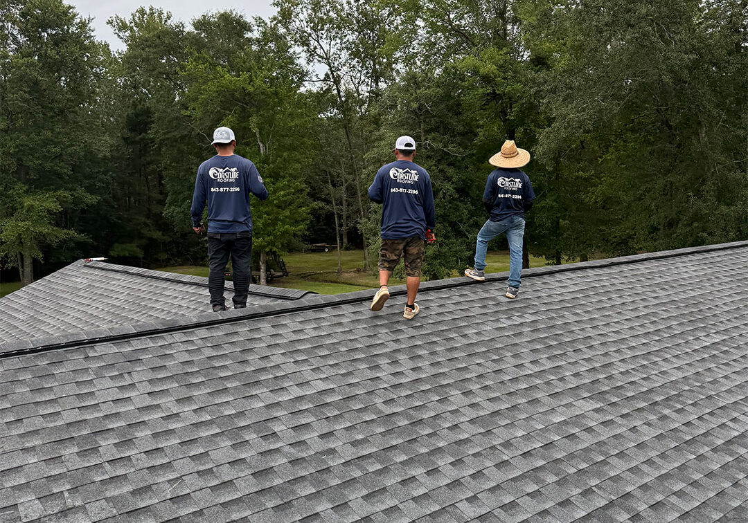 Coastline crew doing a final inspection and clean up on roof replacement.
